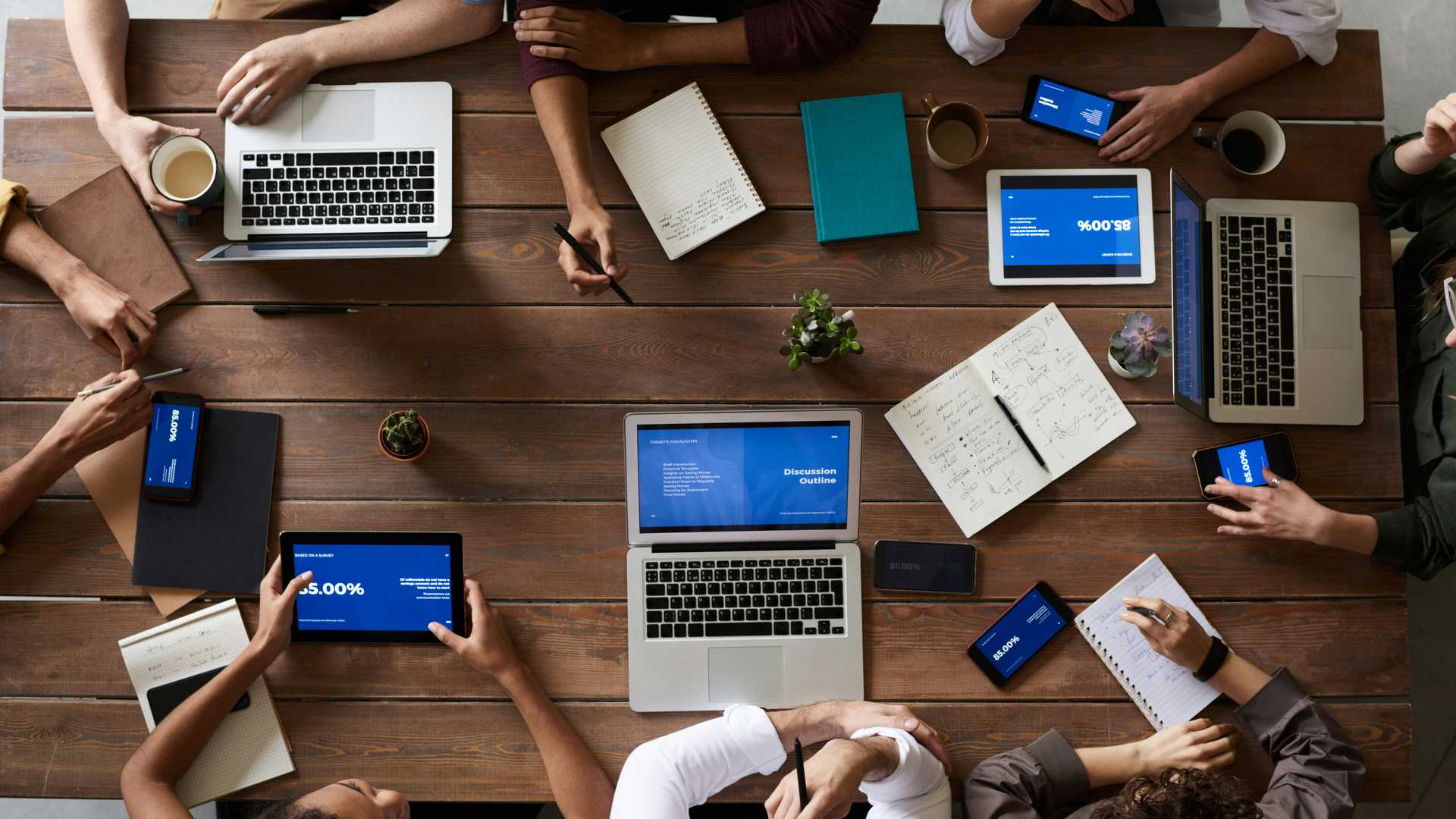 team of people sitting around a table